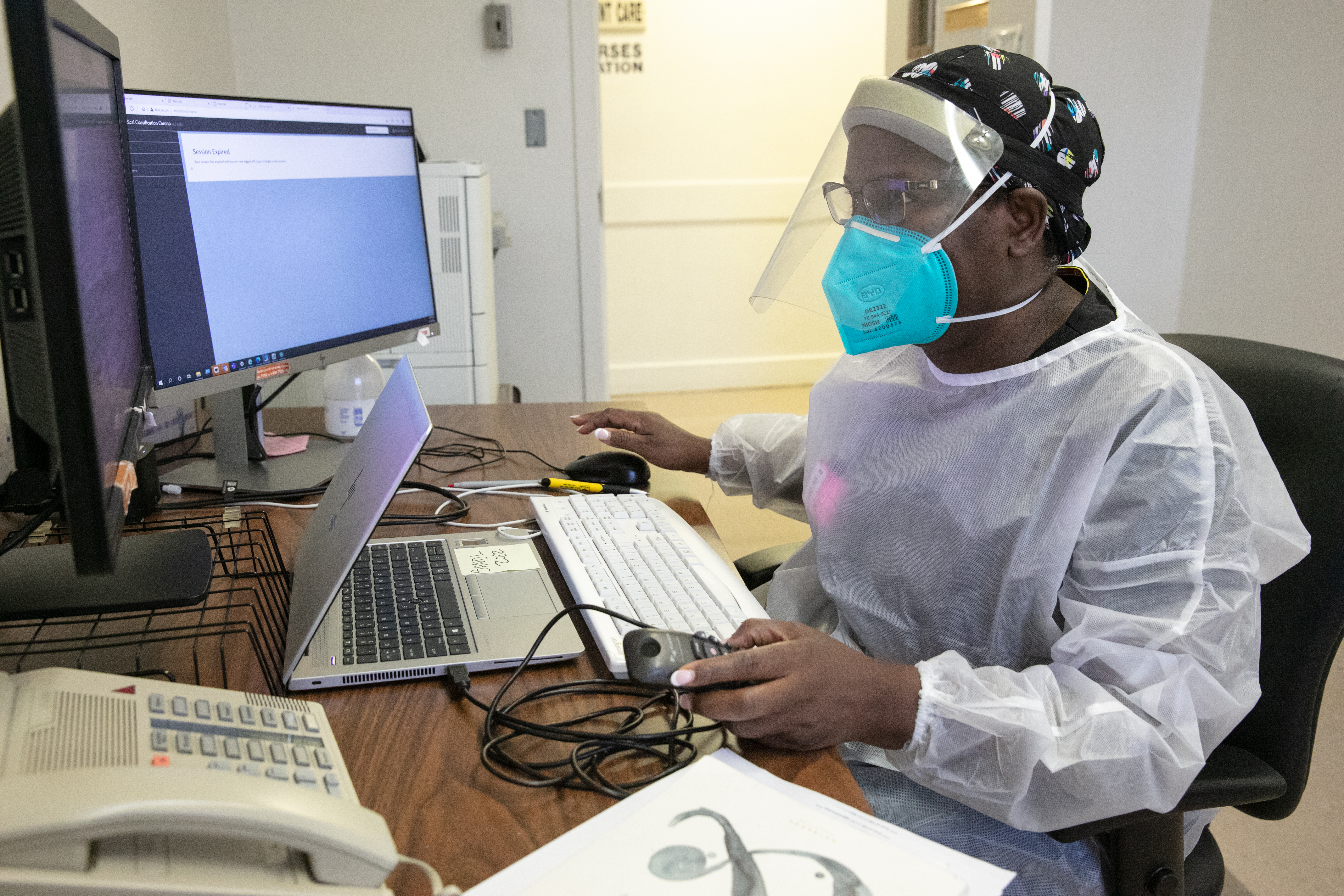 Image of a health care provider working on a computer